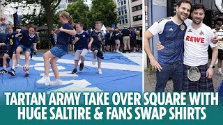 Tartan Army play football on huge Saltire and fans swap shirts in Cologne [upl. by Sirapal777]