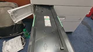 How to Clean the Toner Waste Container on Ricoh M C2000 Printer [upl. by Sihtnyc]