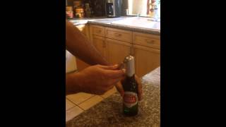 How to open a beer using a bottle opener [upl. by Ailahs50]