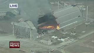 Massive fire burns through historic hangar in California [upl. by Mor139]