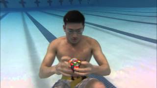 3 Rubiks cubes solved Underwater in 1 minute [upl. by Onoitna]