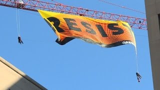 Greenpeace protesters climb crane near White House [upl. by Holub]