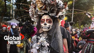 Day of the Dead celebrations quotLa Catrinaquot skeletons parade through Mexico City [upl. by Shirberg]