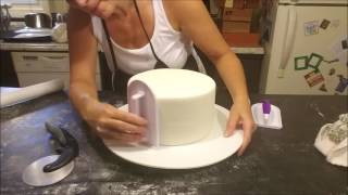 covering cake with fondant [upl. by Corabel]