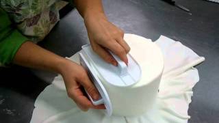 Covering a cake with fondant [upl. by Seyler]